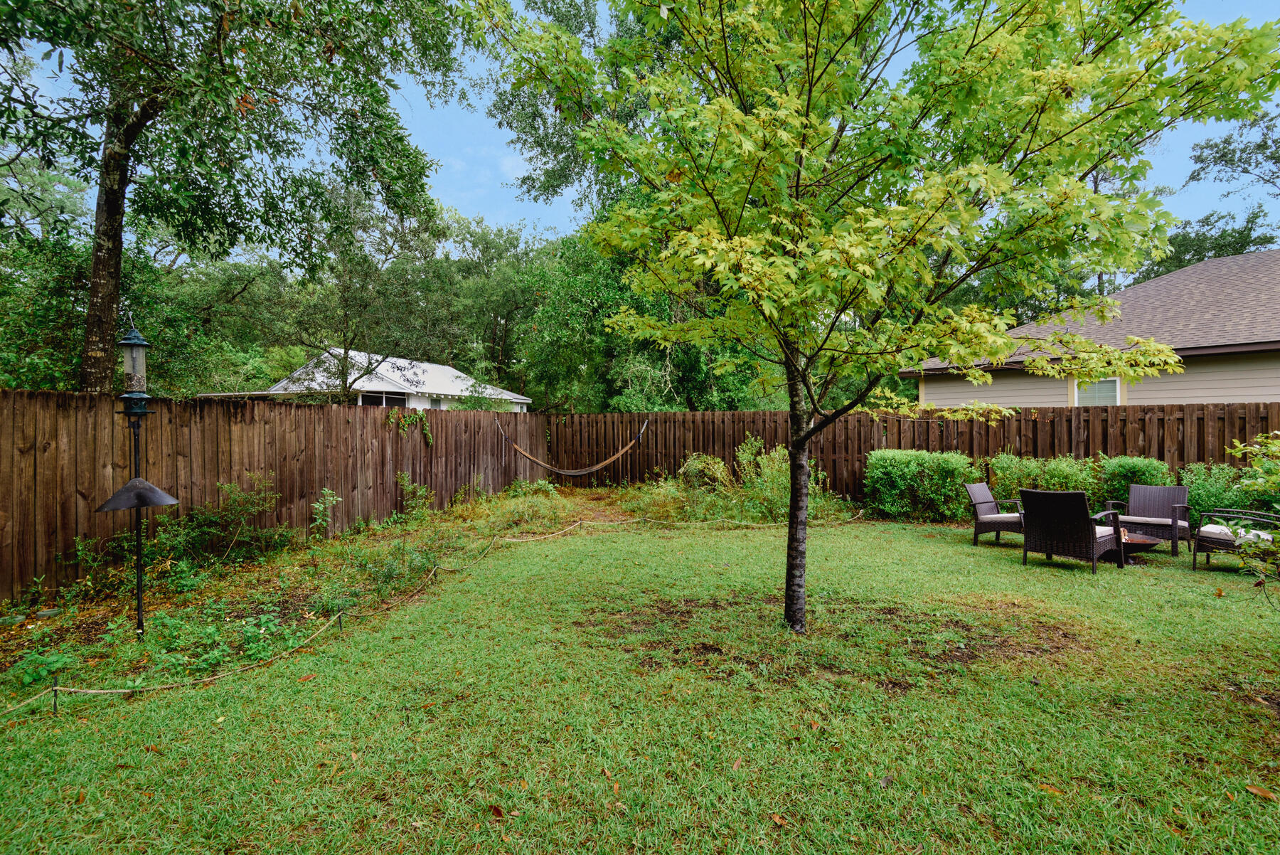 43 Hollyn Court Freeport, FL 32439 - Photo 29 of 35 a view of a backyard with a table and chairs