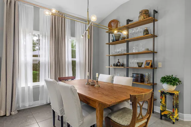 a room with table and stairs