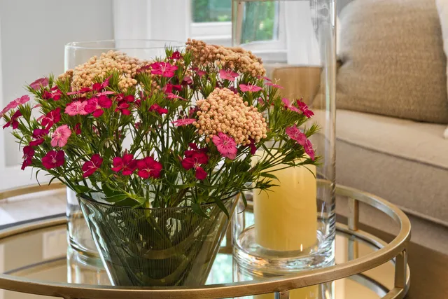 a kitchen with stainless steel appliances granite countertop a sink and a refrigerator