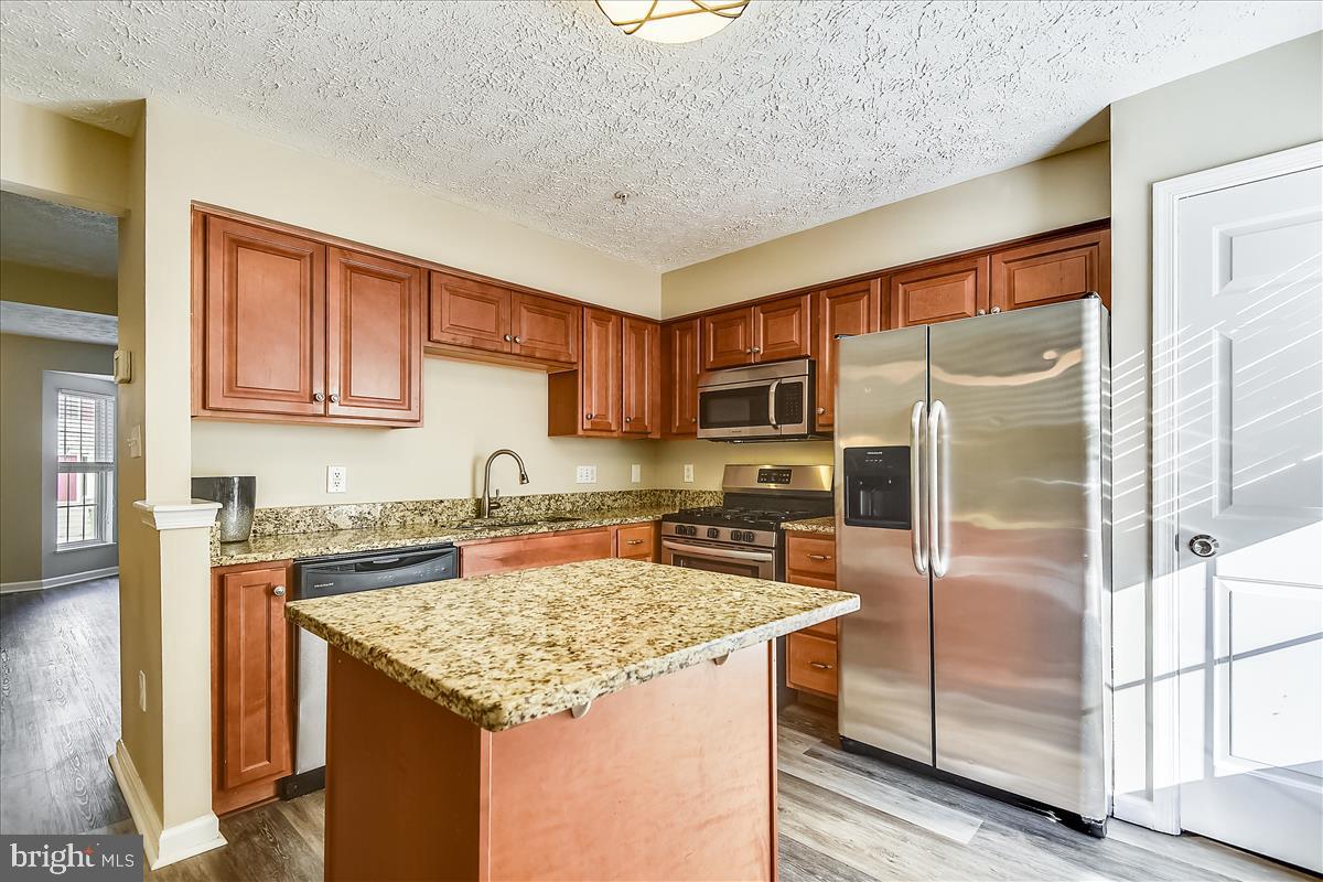 Kitchen island and stainless appliances