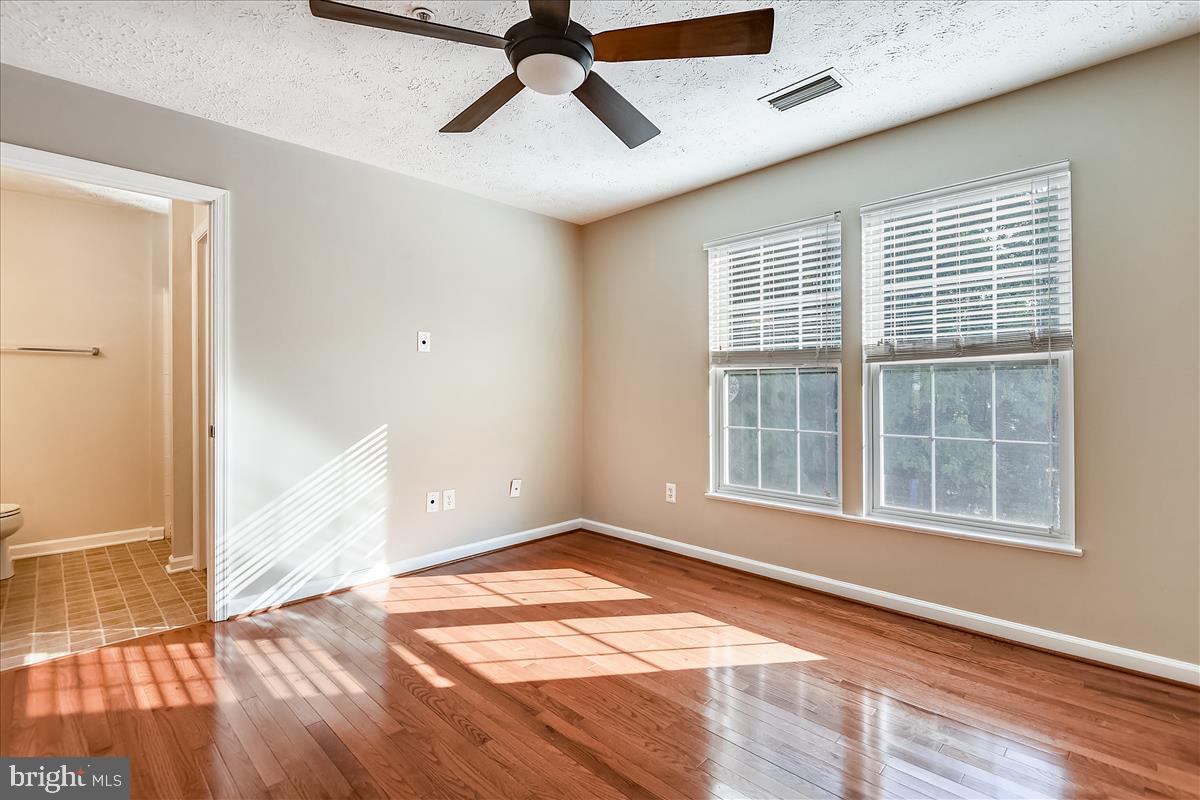 2554 Summers Ridge Drive Odenton, MD 21113 - Photo 10 of 20 Primary bedroom with wood floors
