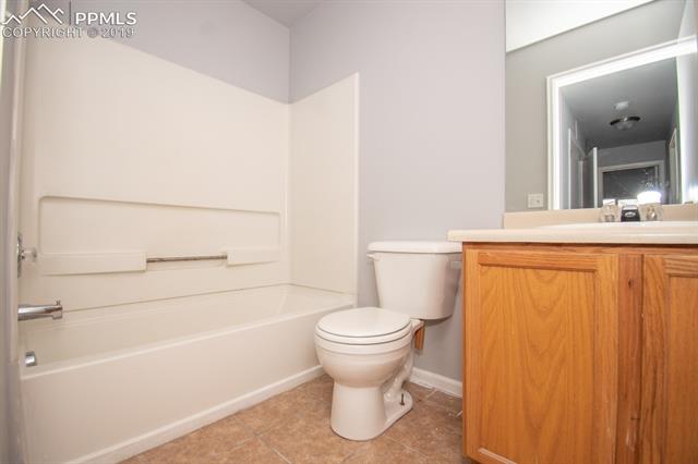 6734 Akron Road Colorado Springs, CO 80923 - Photo 19 of 31 Shared Hallway bathroom