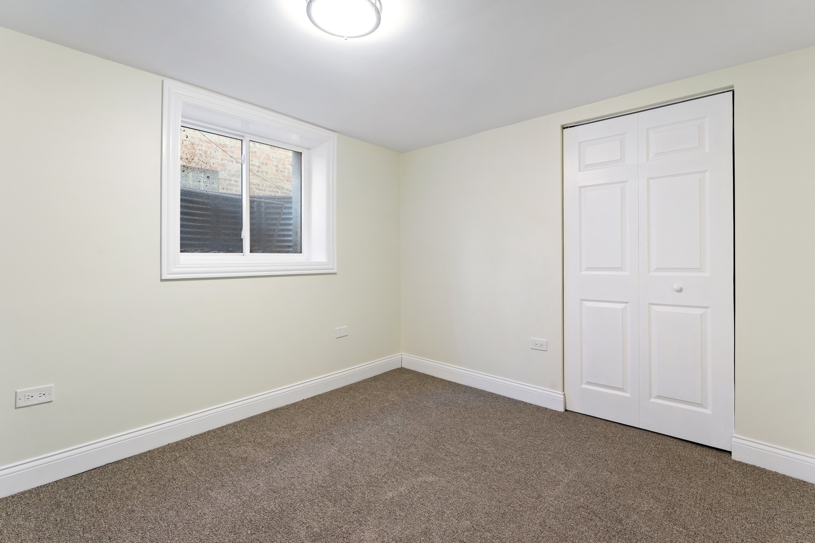 10954 South Normal Avenue Chicago, IL 60628 - Photo 12 of 17 an empty room with a window