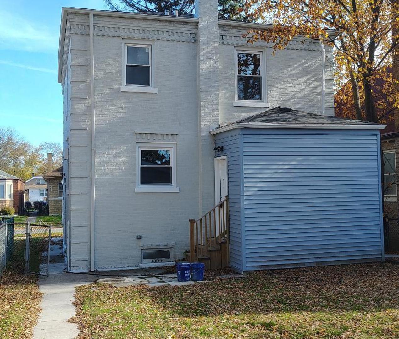 10954 South Normal Avenue Chicago, IL 60628 - Photo 17 of 17 a view of a house with backyard and porch