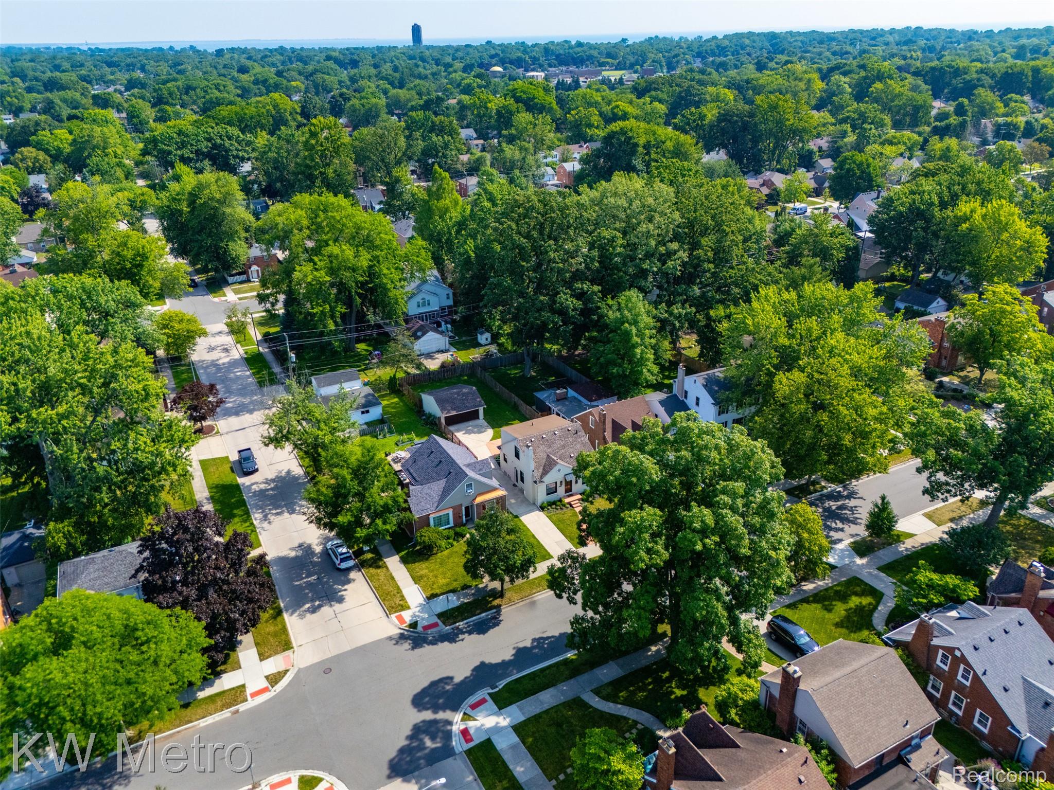 1458 Hampton Road Grosse Pointe, MI 48236 - Photo 38 of 43 Aerial perspective showcasing a residential area characterized by mature trees and paved streets