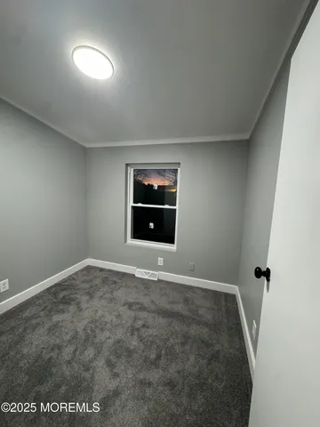 an empty room with a natural light