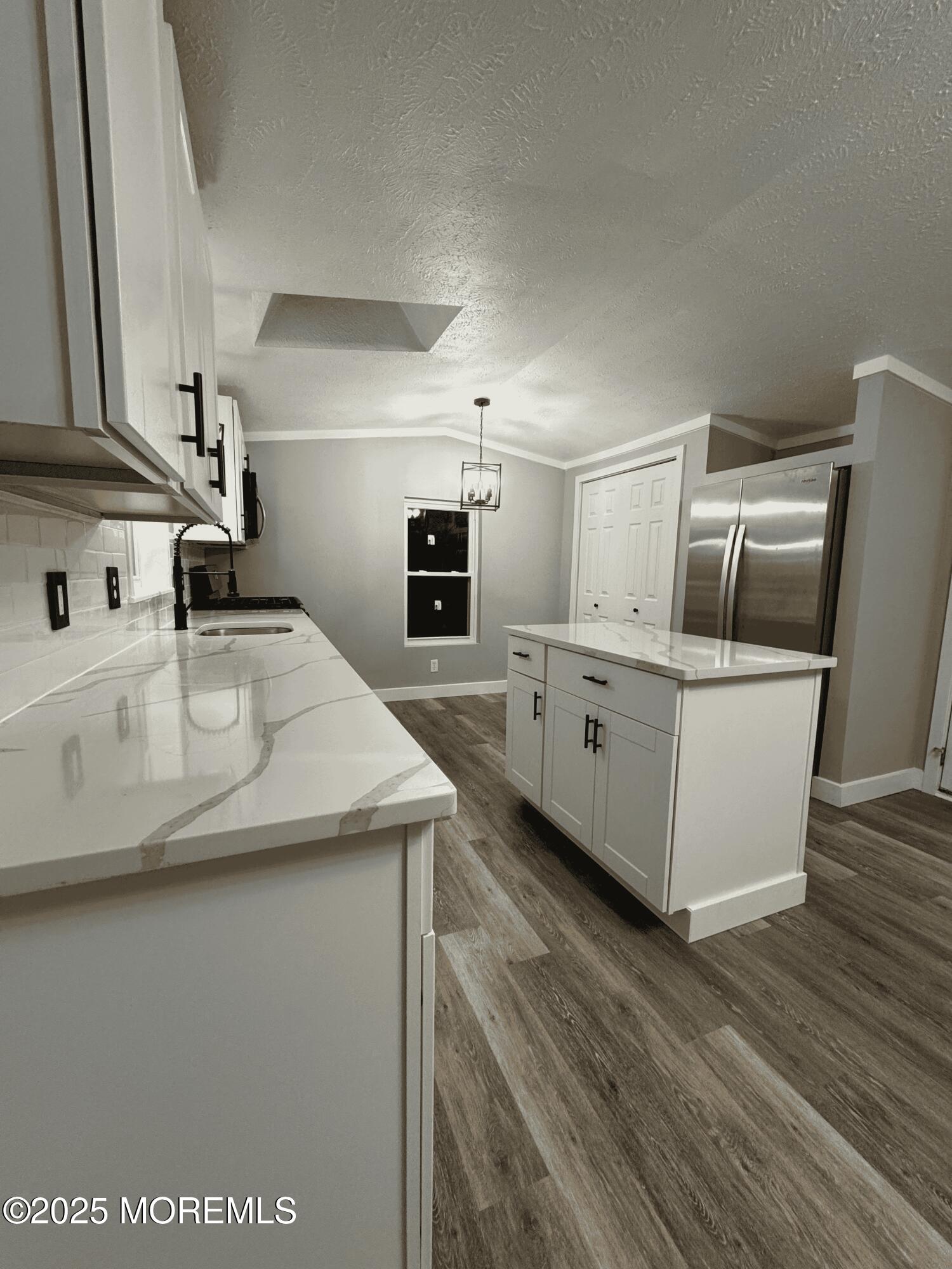 406 4th Street Jackson, NJ 08527 - Photo 5 of 13 a kitchen with stainless steel appliances granite countertop a sink a stove and a microwave oven