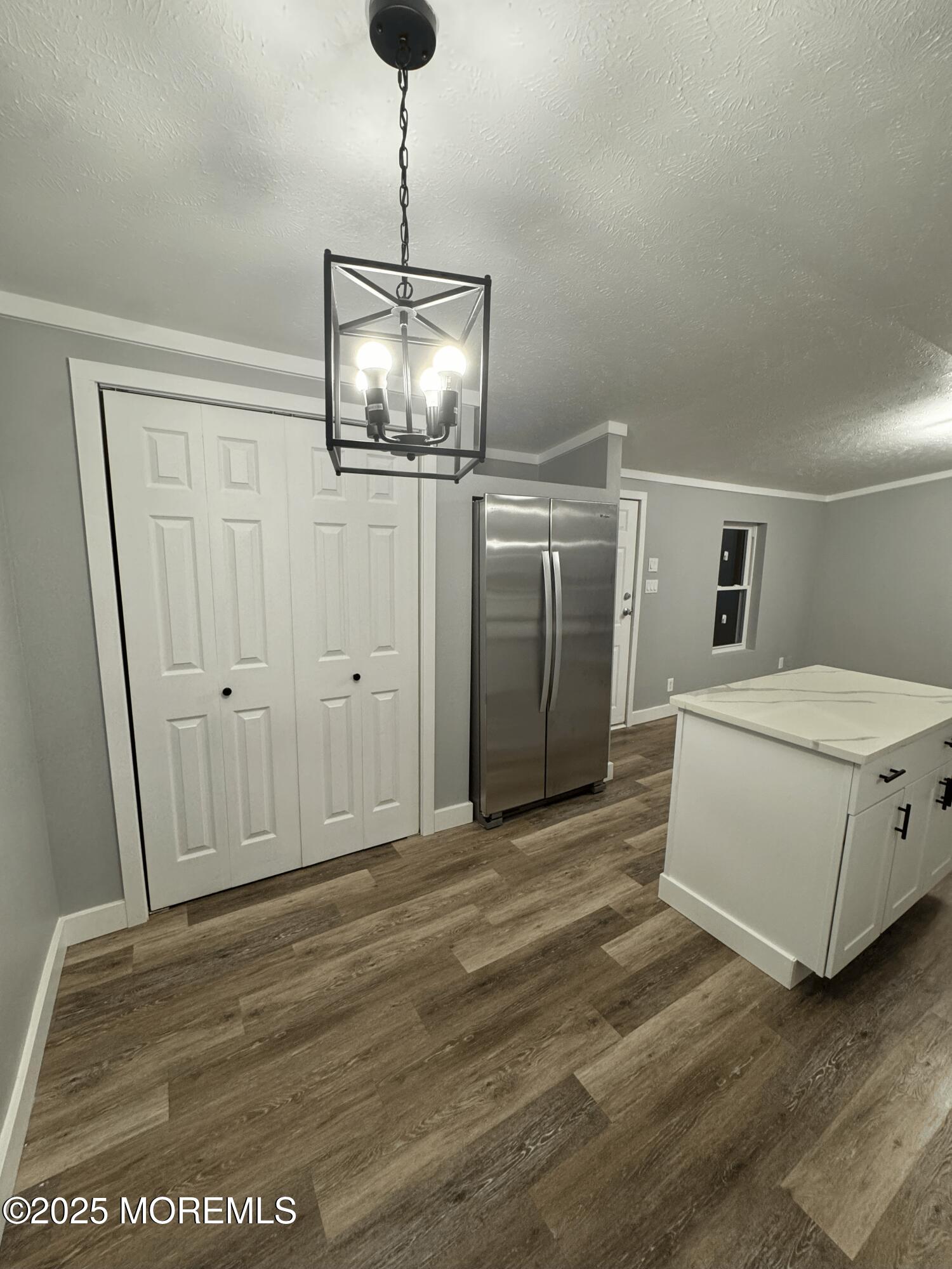 406 4th Street Jackson, NJ 08527 - Photo 6 of 13 a view of a livingroom with a chandelier