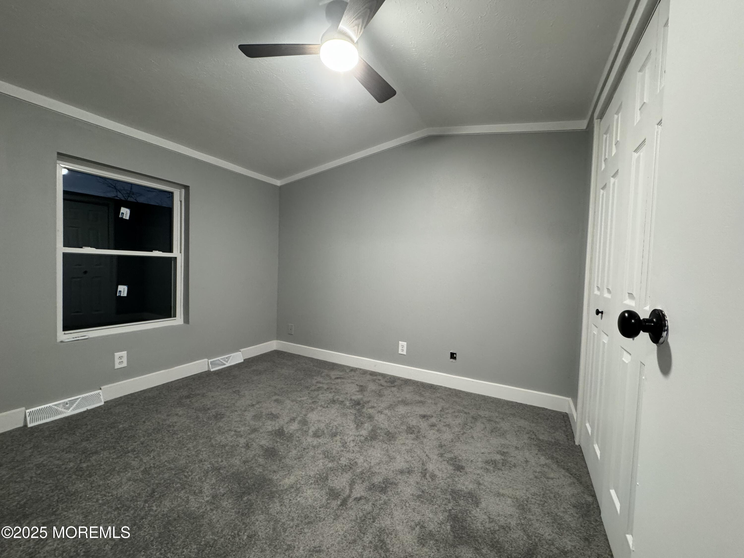 406 4th Street Jackson, NJ 08527 - Photo 10 of 13 an empty room with windows and entrance