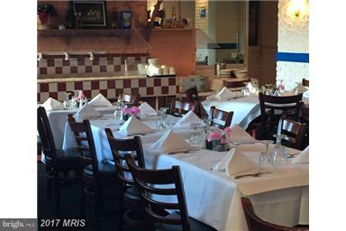 5225 Pooks Hill Road, Unit 620N Bethesda, MD 20814 - Photo 16 of 16 a view of dinning table and chairs in a room