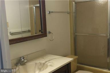 5225 Pooks Hill Road, Unit 620N Bethesda, MD 20814 - Photo 7 of 16 a bathroom with a sink and vanity