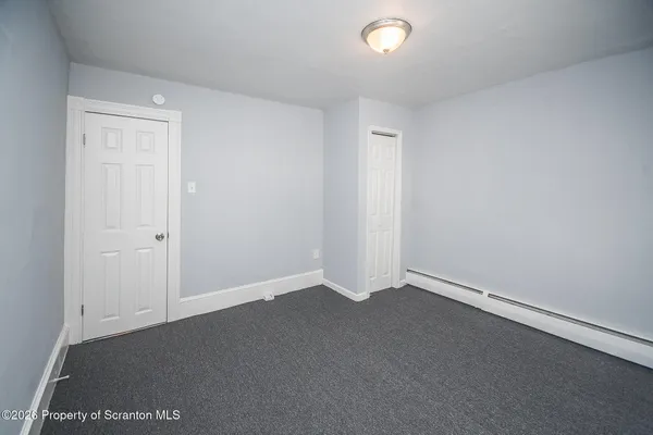 an empty room with a empty space and window