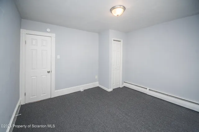 an empty room with a empty space and window