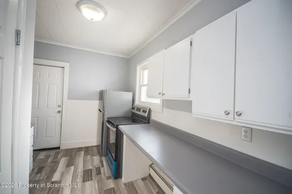 a kitchen with a sink and cabinets