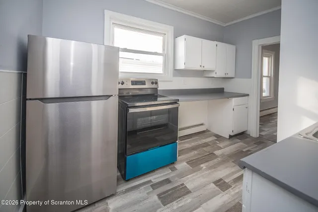 a white refrigerator freezer sitting in a kitchen