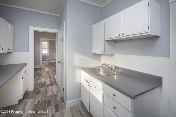a kitchen with stainless steel appliances granite countertop a sink dishwasher stove and cabinets