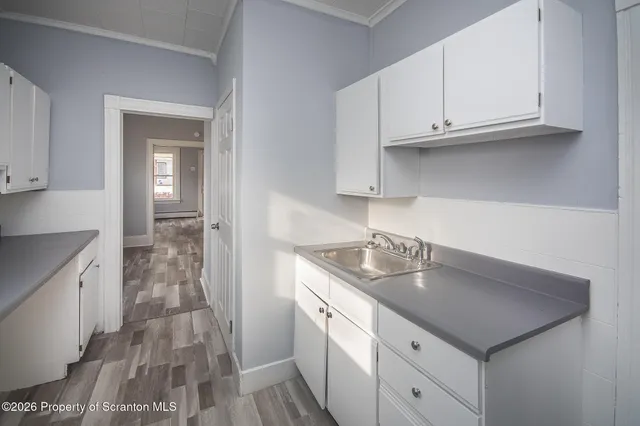 a kitchen with stainless steel appliances granite countertop a sink dishwasher stove and cabinets