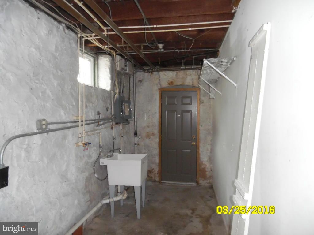 3003 Batavia Avenue Baltimore, MD 21214 - Photo 21 of 23 a bathroom with a shower and a sink