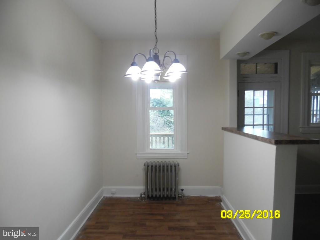 3003 Batavia Avenue Baltimore, MD 21214 - Photo 5 of 23 a bathroom with a window and a chandelier