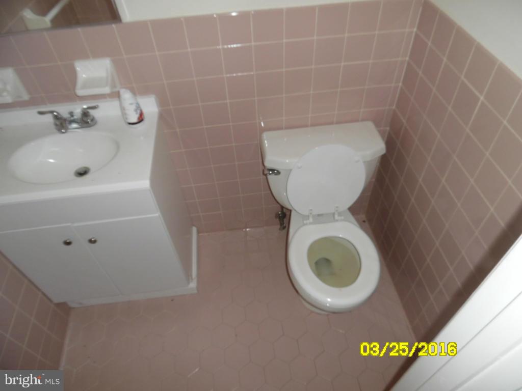 3003 Batavia Avenue Baltimore, MD 21214 - Photo 8 of 23 a bathroom with a toilet and a sink