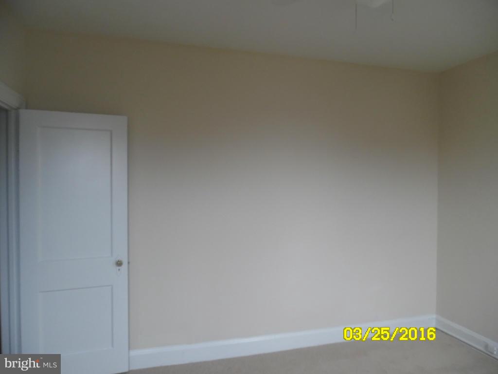 3003 Batavia Avenue Baltimore, MD 21214 - Photo 9 of 23 a view of a refrigerator with wooden floor