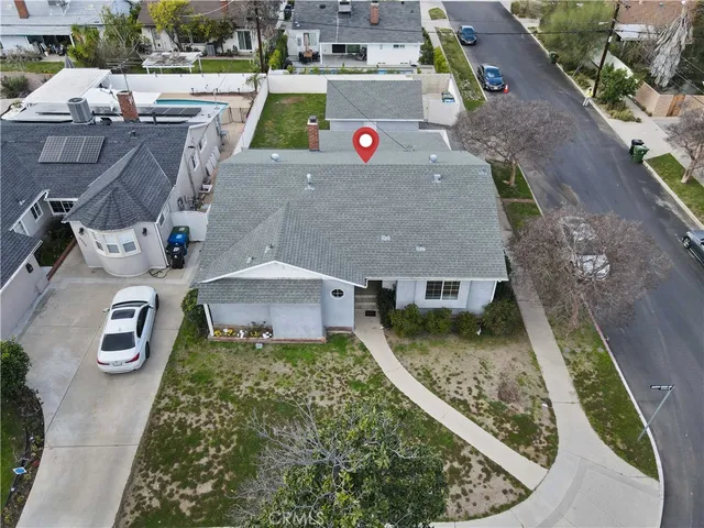 an aerial view of a house with swimming pool
