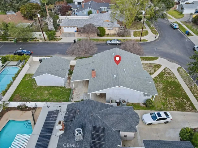 an aerial view of residential houses with outdoor space