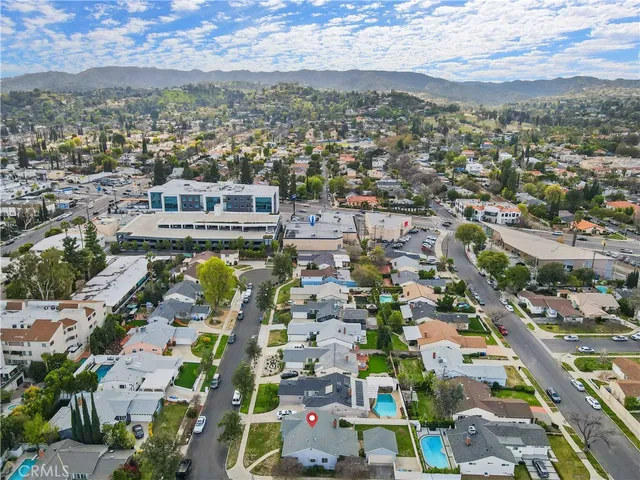 an aerial view of residential houses with outdoor space