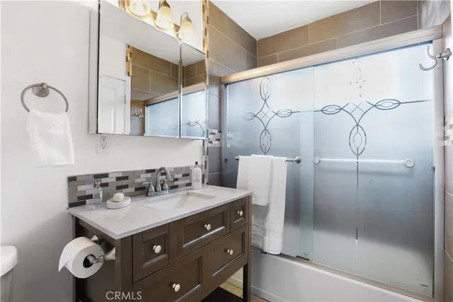 a bathroom with a sink and mirror