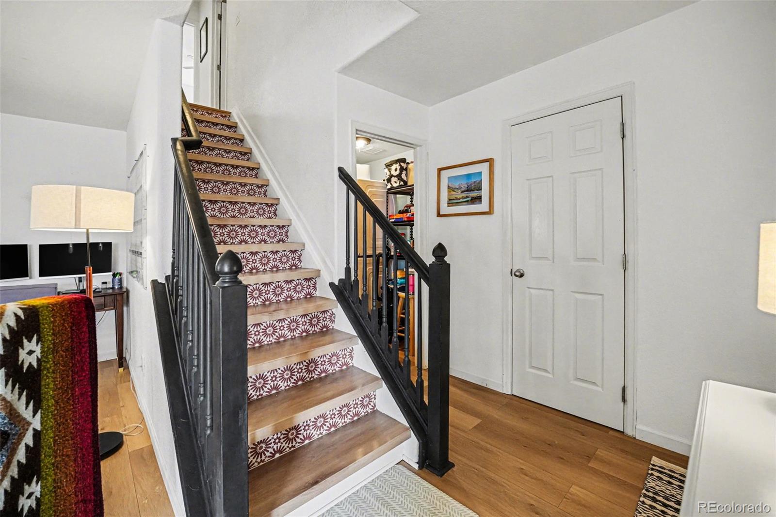 9704 Marmot Ridge Circle Littleton, CO 80125 - Photo 11 of 21 a view of an entryway with wooden floor