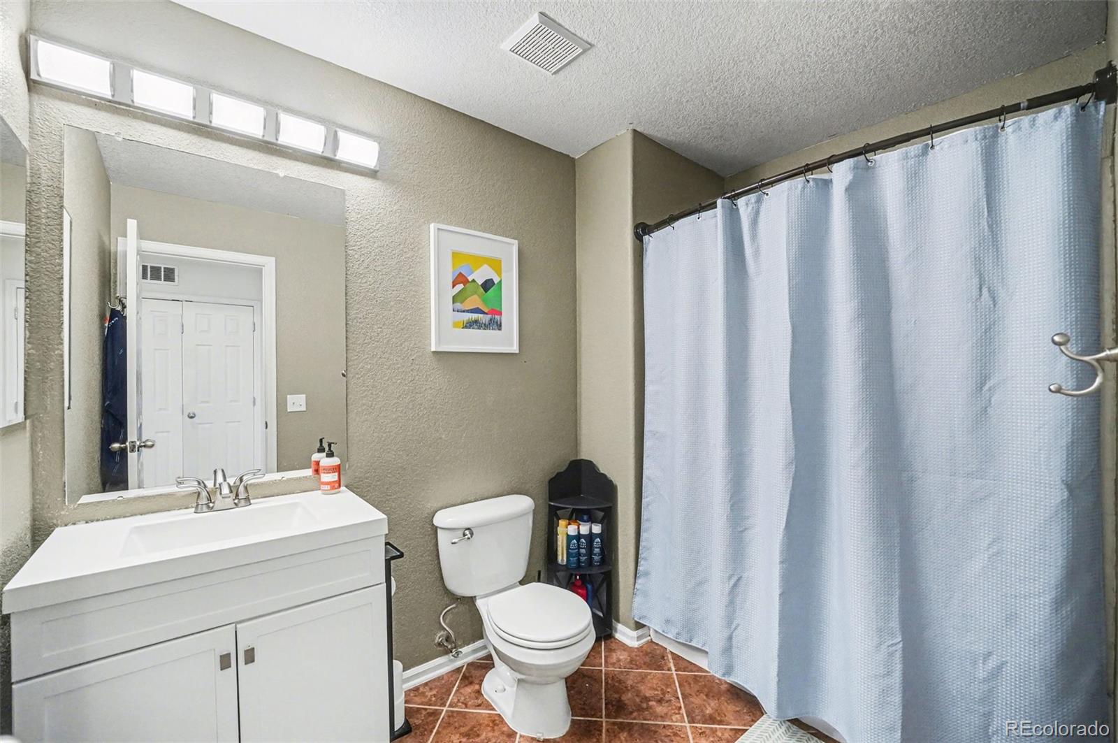 9704 Marmot Ridge Circle Littleton, CO 80125 - Photo 17 of 21 a bathroom with a sink and a mirror