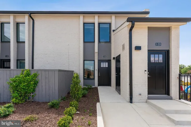 a front view of a house with a garage