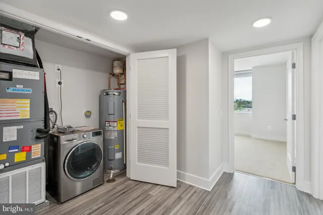 a view of a hallway with washer and dryer