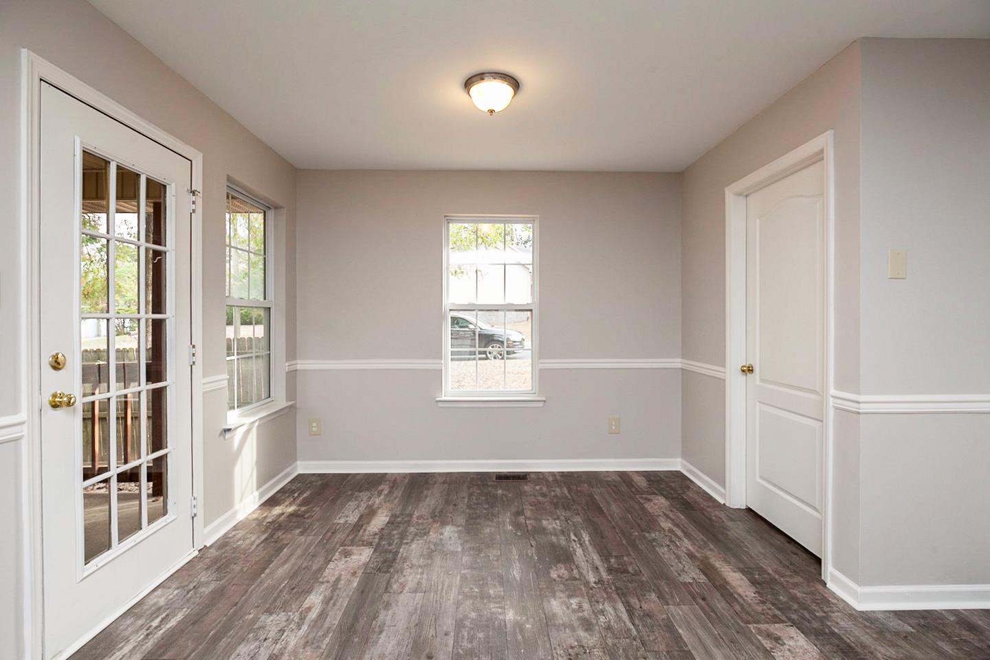 3045 Stone Bridge Road Antioch, TN 37013 - Photo 7 of 20 a view of an empty room with a window and wooden floor