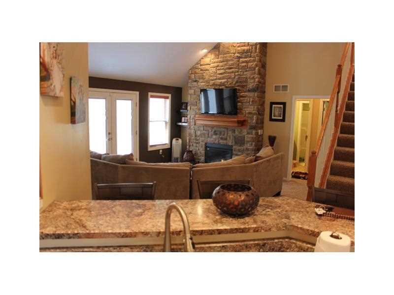 148 York Way Monaca, PA 15061 - Photo 5 of 25 Kitchen. The open concept through the kitchen into the living area makes it easy to watch TV while washing dishes or sit and chat with friends at the bar.
