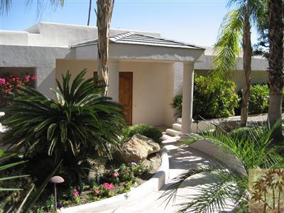 a view of a house with a tree
