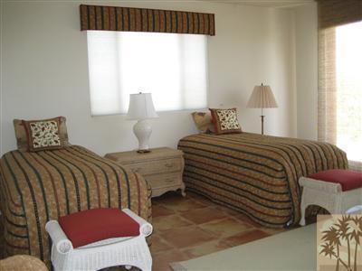 70248 Calico Road Rancho Mirage, CA 92270 - Photo 6 of 9 a bedroom with a bed and window