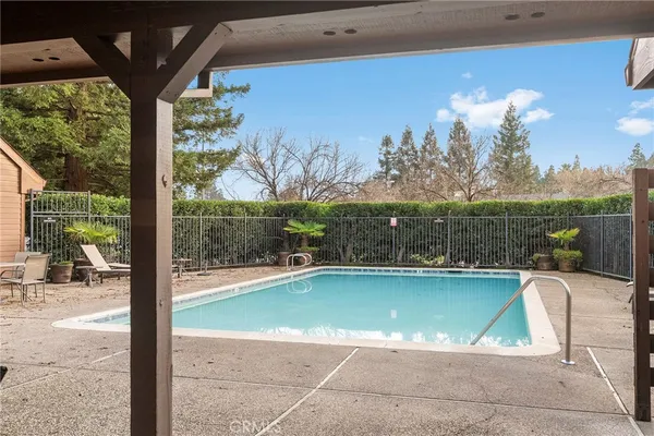 a view of a swimming pool with a patio