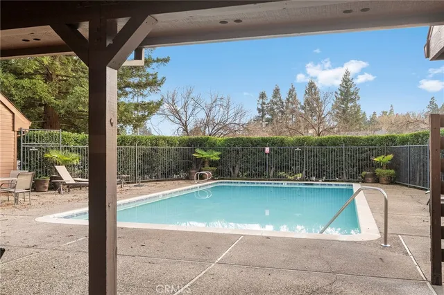 a view of a swimming pool with a patio