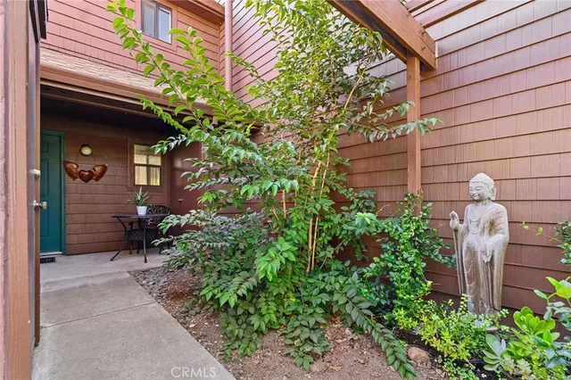 a view of a kitchen with wooden floor and a refrigerator