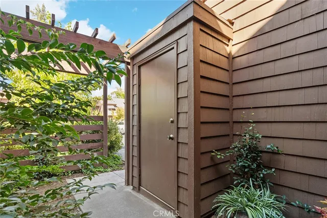 a view of a room with wooden floor and white walls
