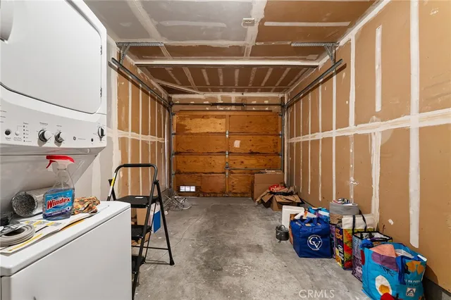 a view of a yard with plants and a tree