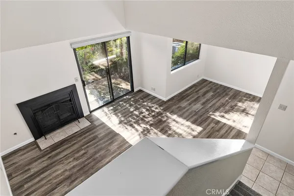 a view of living room with window and wooden floor