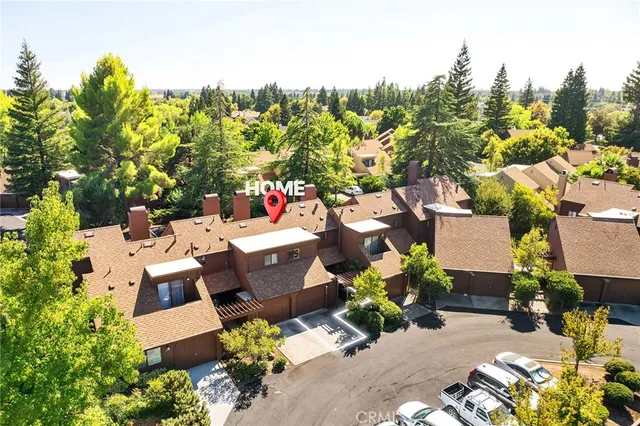 an aerial view of a house with a yard