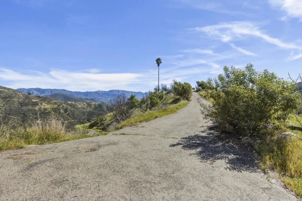 10148 Alex Fallbrook, CA 92028 - Photo 5 of 22 a view of a road with a big yard