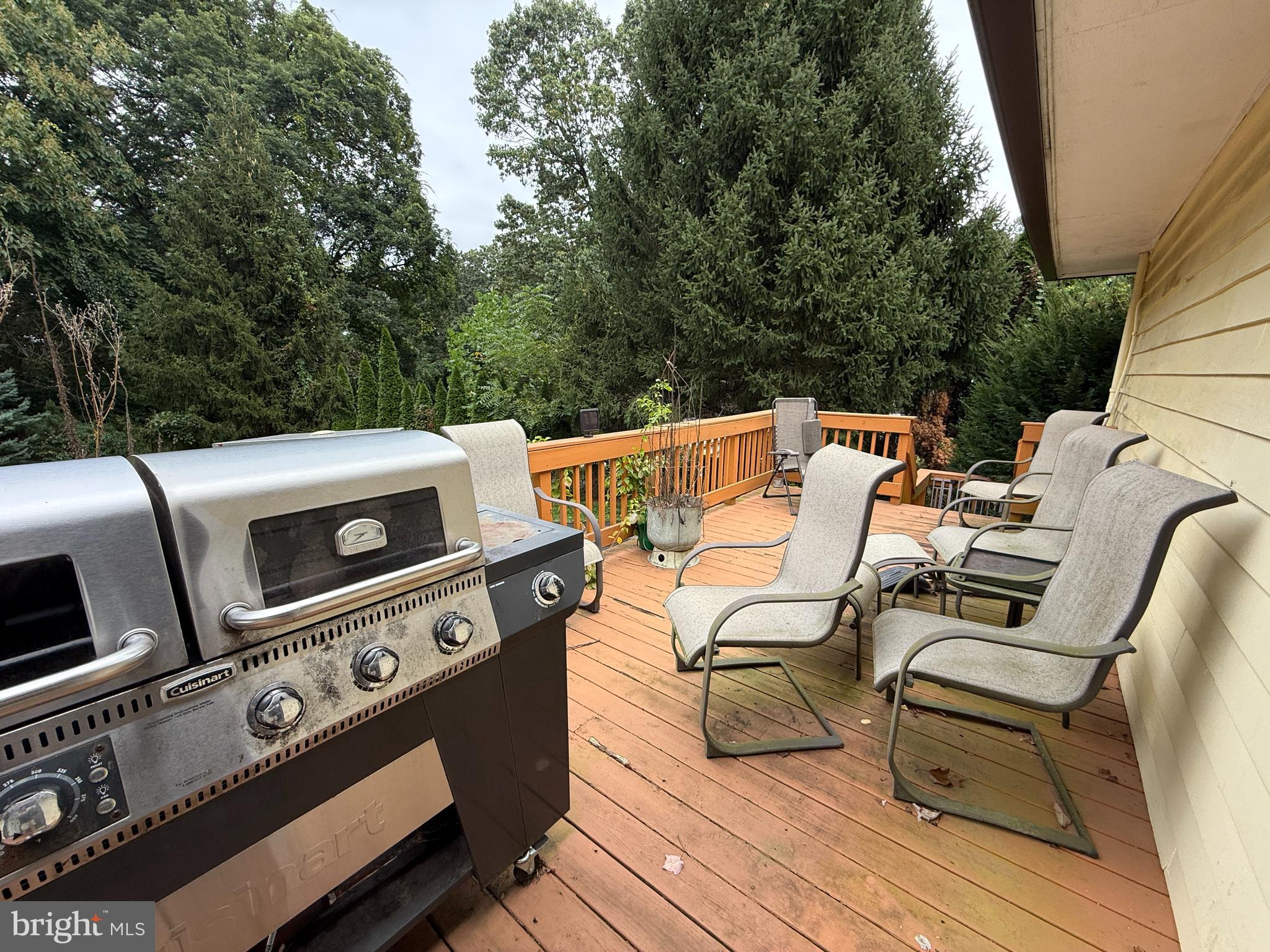 1667 Beacon Hill Road Downingtown, PA 19335 - Photo 13 of 23 a view of a patio with table and chairs with wooden floor and fence