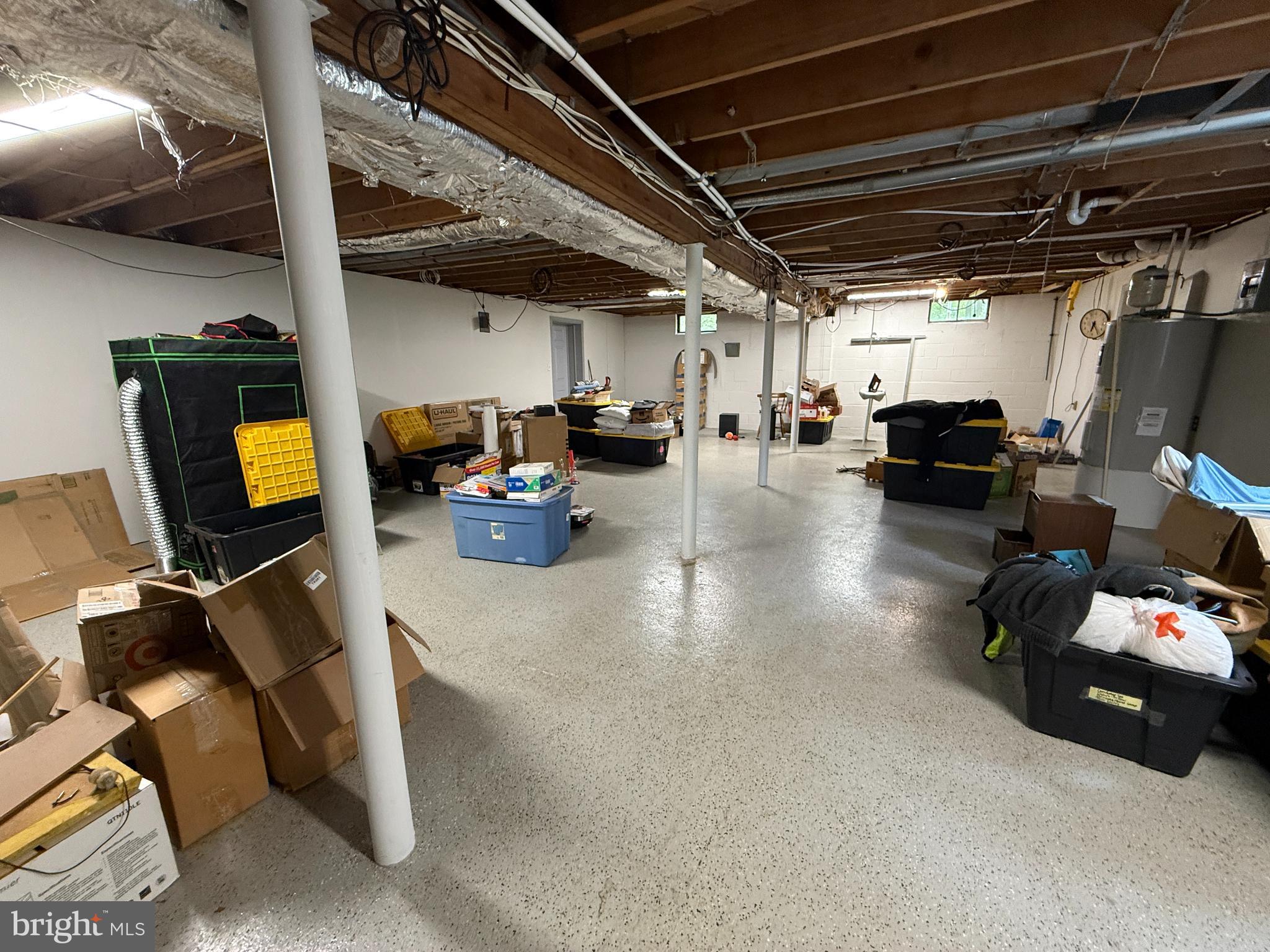 1667 Beacon Hill Road Downingtown, PA 19335 - Photo 16 of 23 a gym room with furniture and a flat screen tv