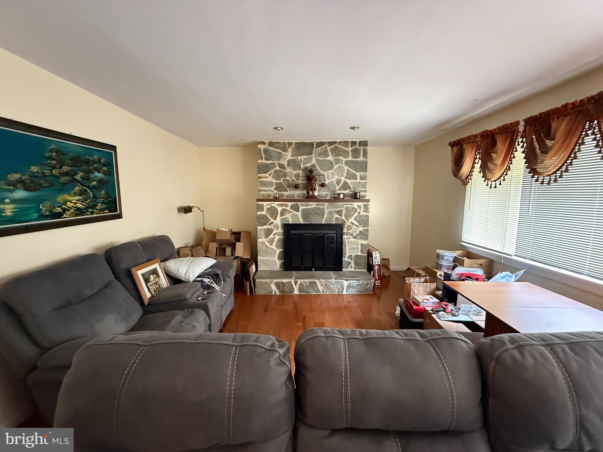 1667 Beacon Hill Road Downingtown, PA 19335 - Photo 2 of 23 a living room with furniture and a fireplace