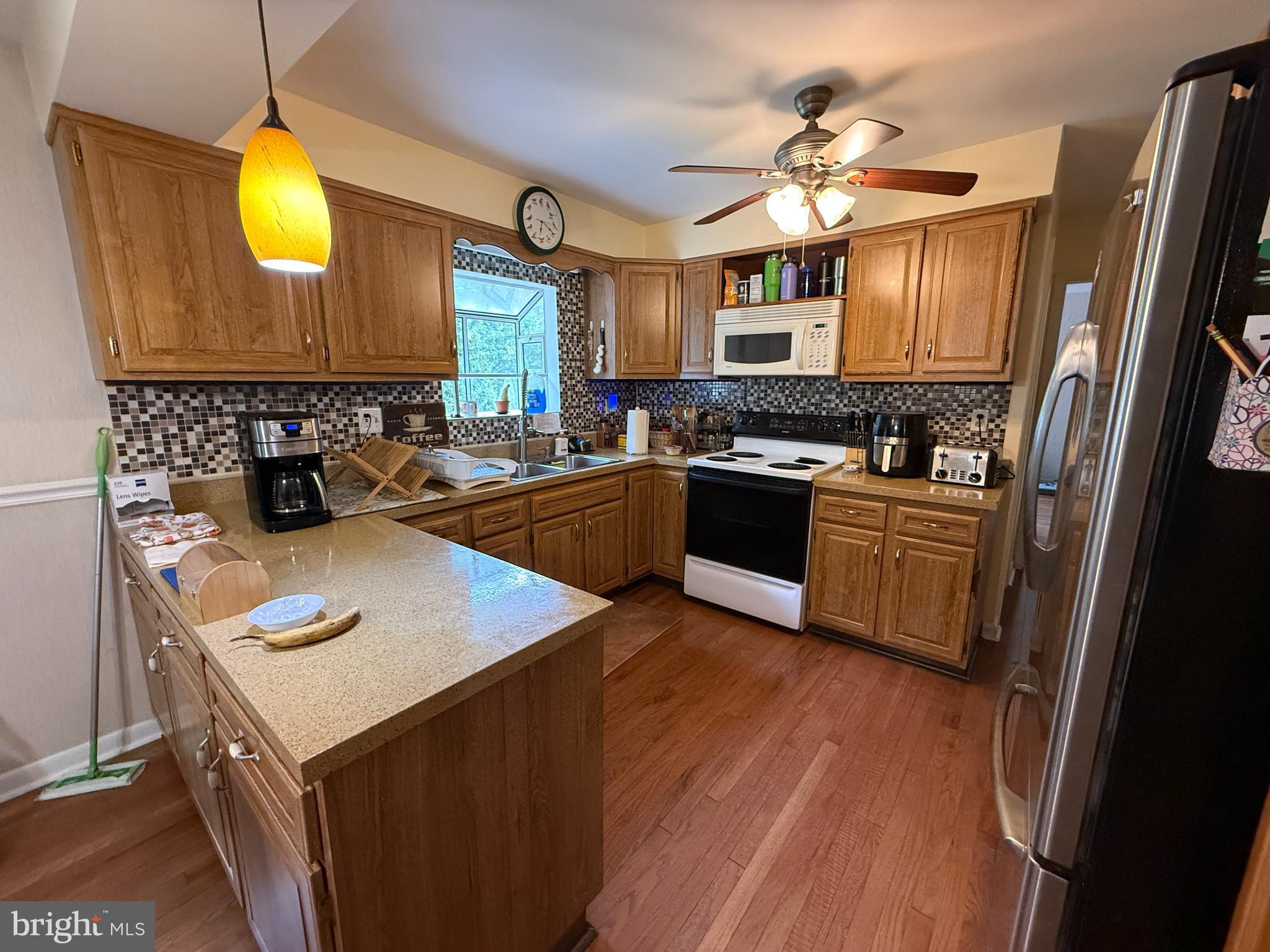 1667 Beacon Hill Road Downingtown, PA 19335 - Photo 3 of 23 a kitchen with a sink appliances and cabinets
