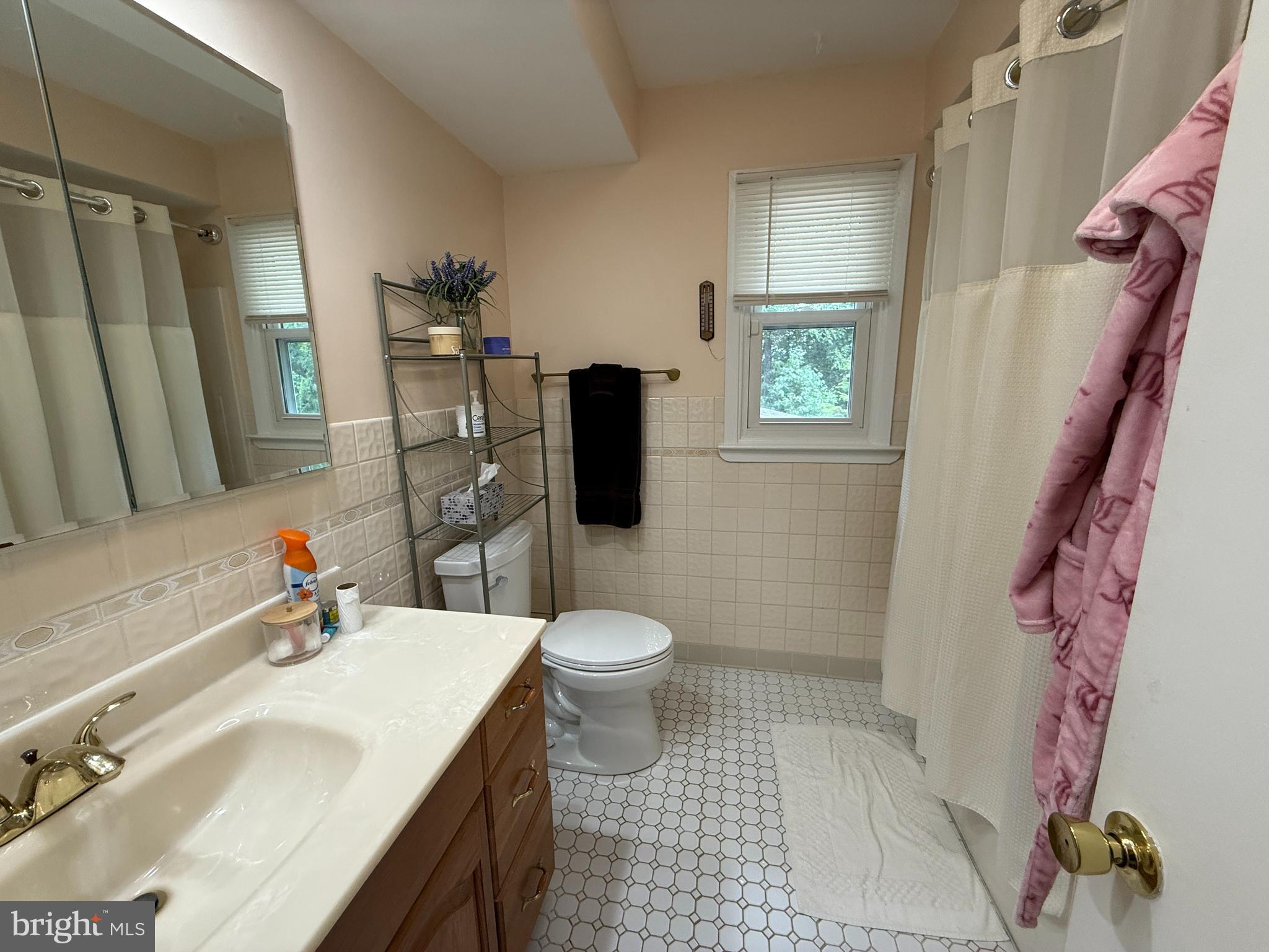 1667 Beacon Hill Road Downingtown, PA 19335 - Photo 4 of 23 a bathroom with a sink toilet and shower